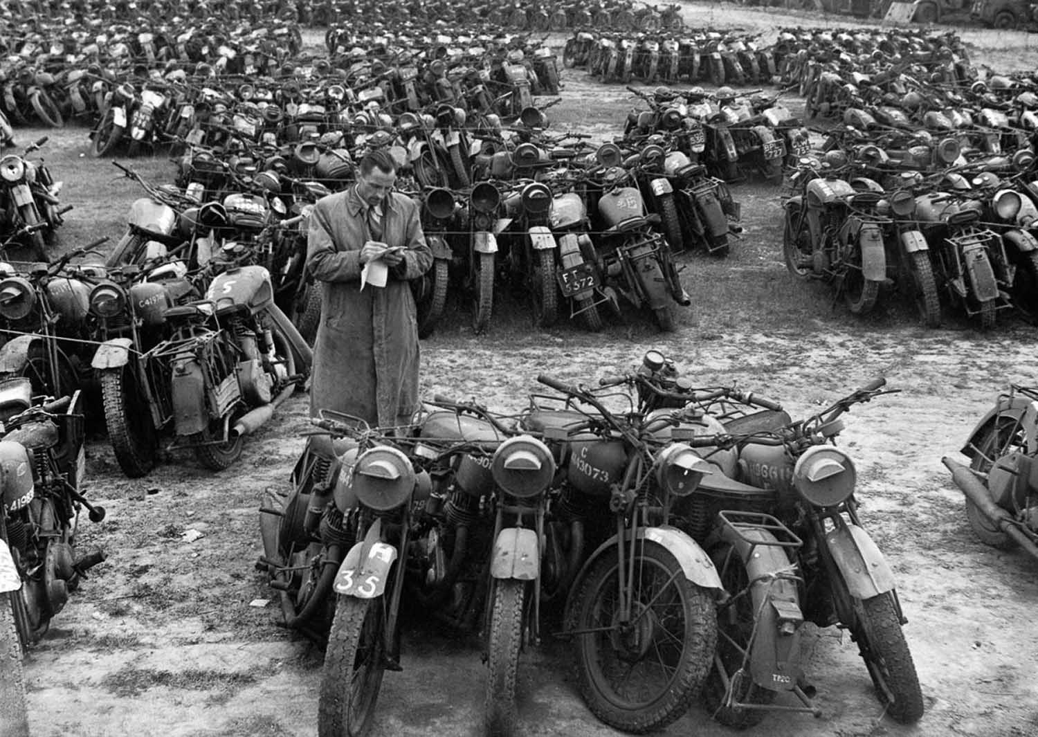 Surplus motorcycles in England are bundled in groups of five to be sold as scrap.