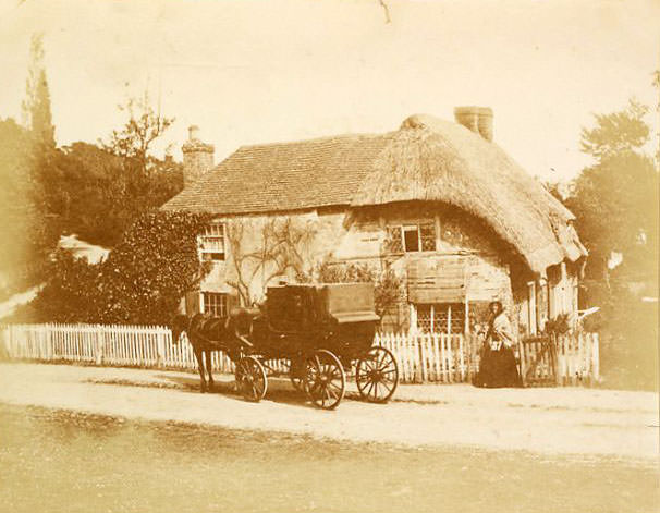 Carriage outside unidentified house