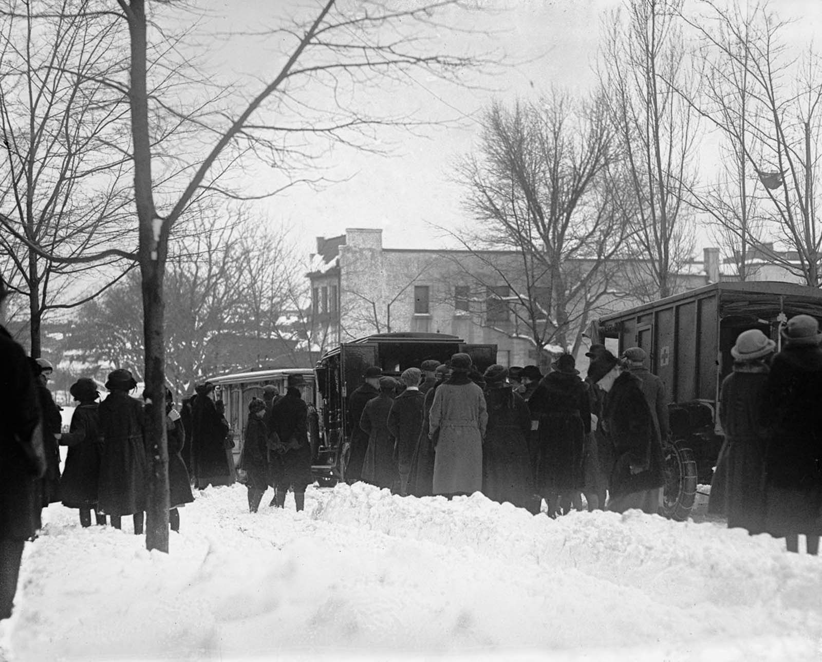 Onlookers gather outside the Knickerbocker Theatre.