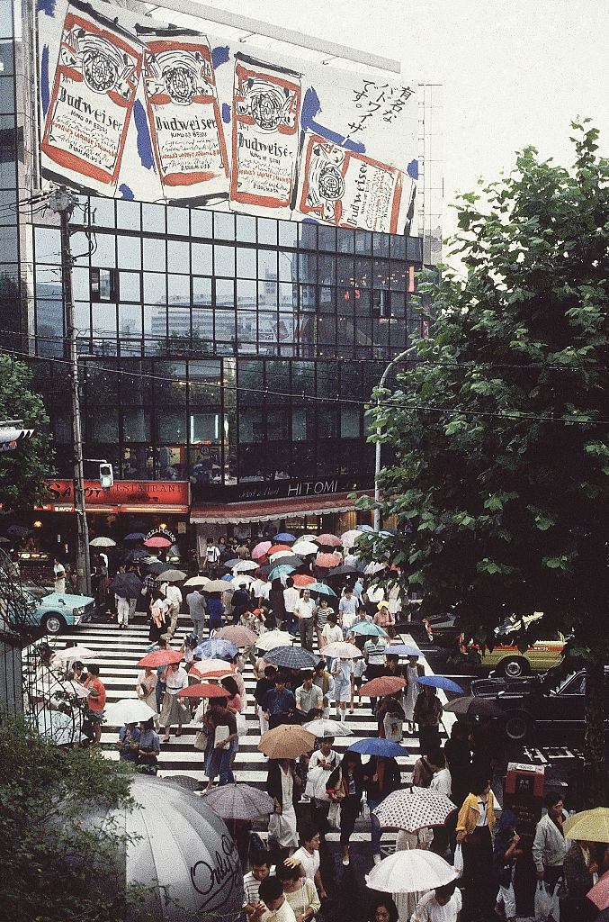 Billboards and Pedestrians with Umbrellas on Tokyo Street, 1980s