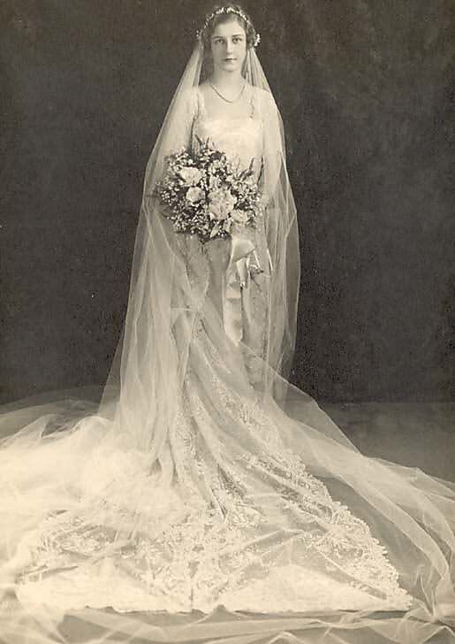 Bride in exquisite French wedding dress, 1877