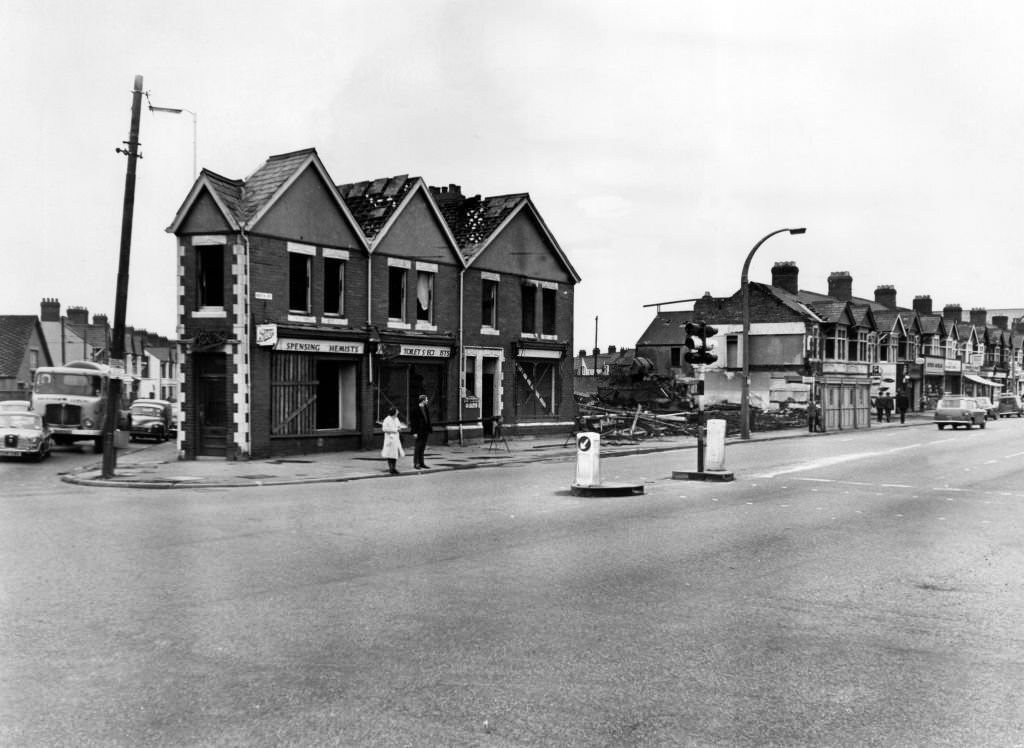 The demolition men are changing the face of the Gabalfa, Cardiff, junction of Western Avenue, North Road and Whitchurch Road. These shops and houses on the corner of Whitchurch Road are the latest to come down to make way for a roundabout which will be in use while work continues on the Eastern by-pass, 20th August 1968.