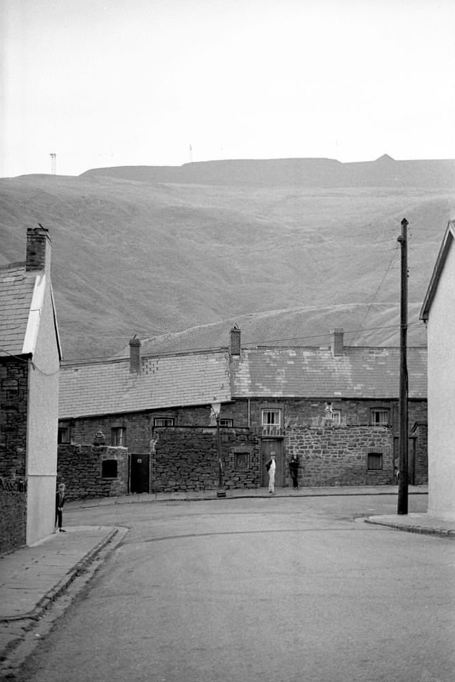 Children stand on the street in the mining town of Tonypandy, Wales, United Kingdom, 1966.