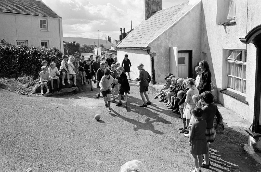 General shots of the village Rhiwlas, in Bangor, Gwynedd, Wales. Children playing outdoors, 20th September 1964.