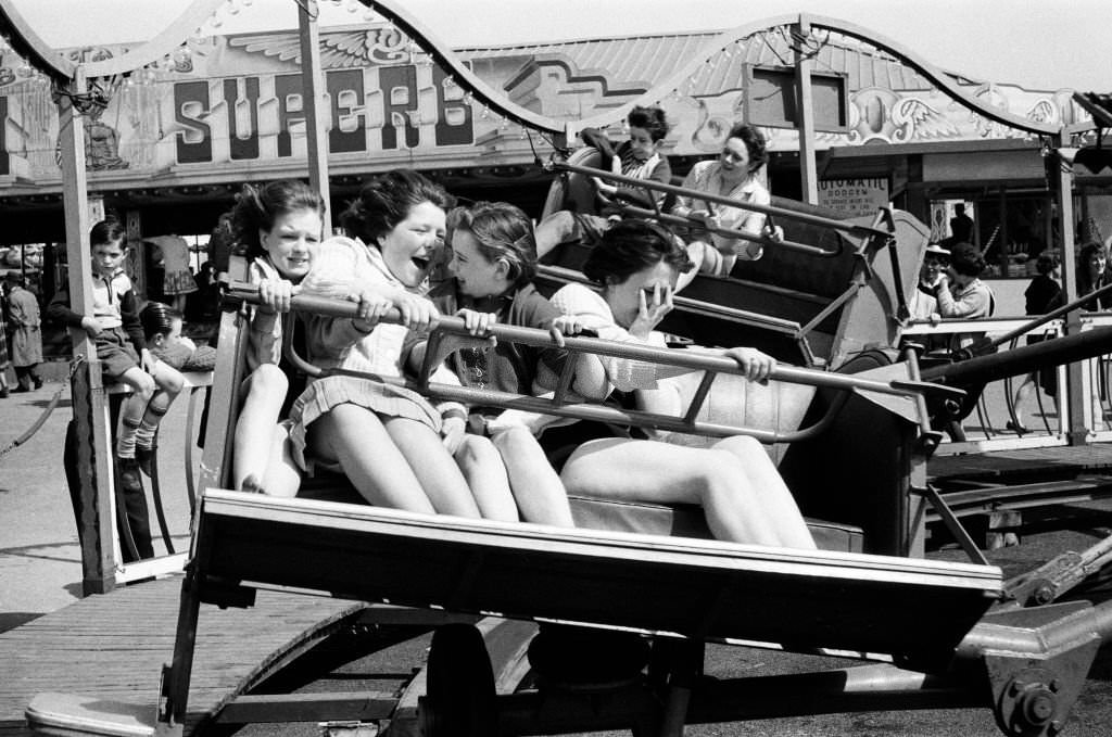 A group of girls at the fairground at Barry Island, Vale of Glamorgan, Wales, 23rd April 1962.
