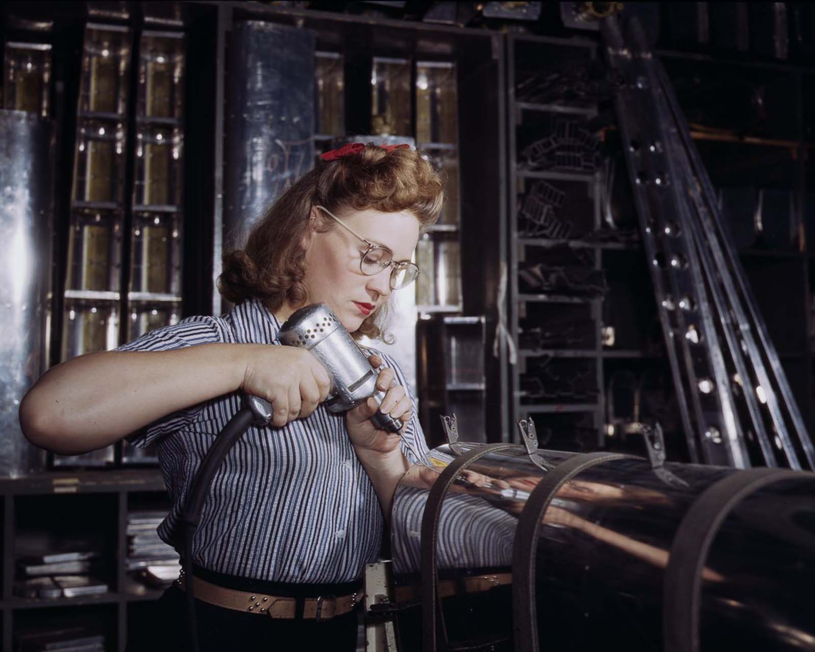A North American Aviation employee assembles a section of the leading edge for the horizontal stabilizer of a plane at the plant in Inglewood, California, 1942.