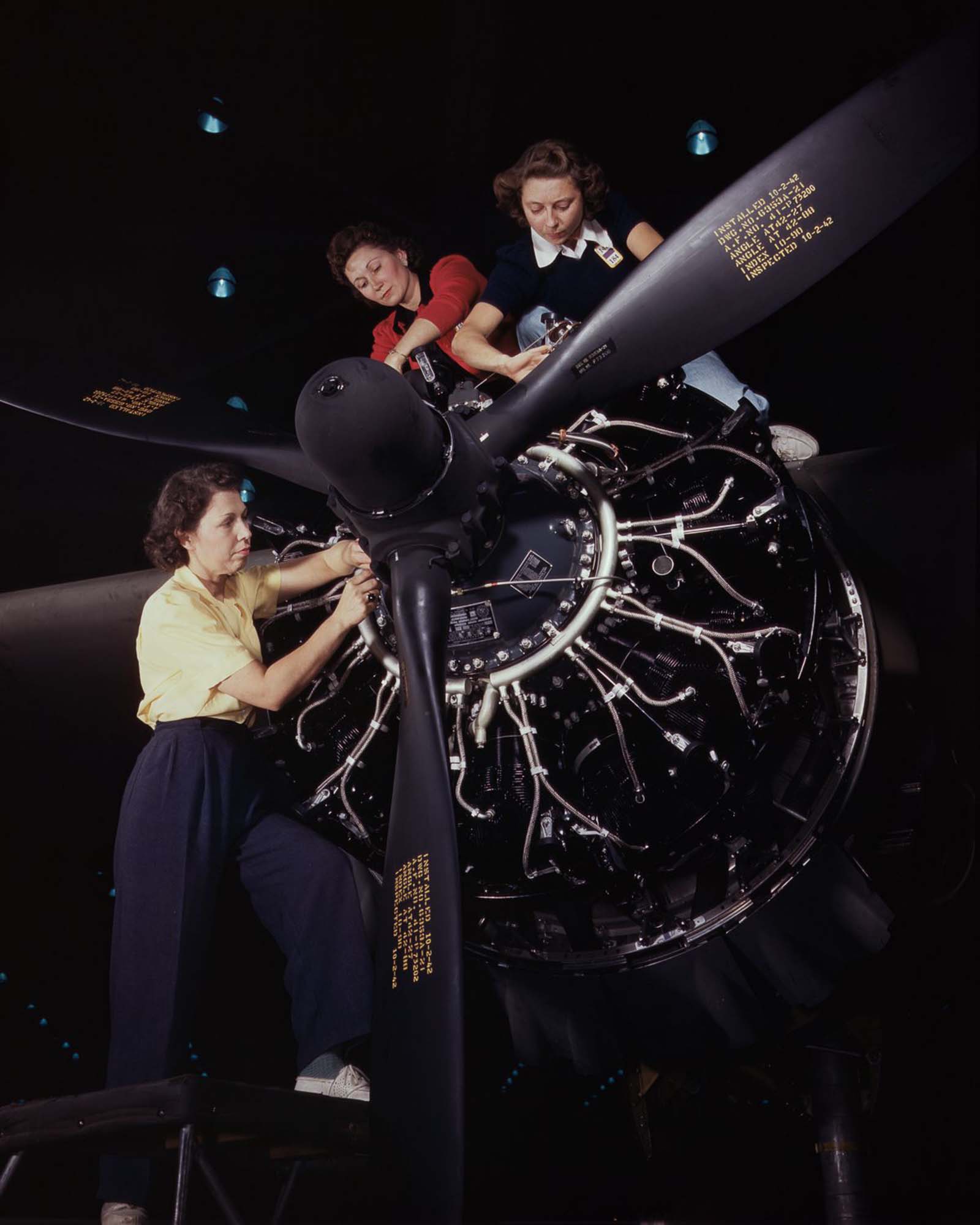 Workers assemble an airplane motor at the Douglas Aircraft Company plant in Long Beach, California, 1942.