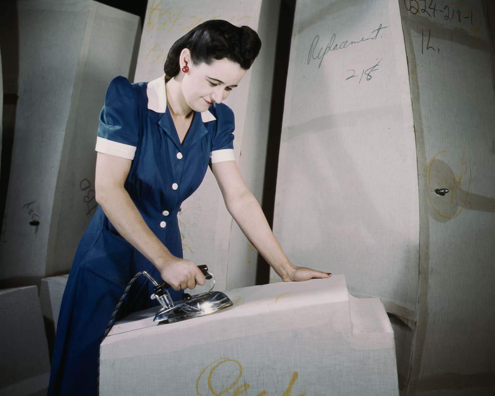 A worker irons at a factory for self-sealing gas tanks owned by the Goodyear Tire and Rubber Co. in Akron, Ohio, 1941.