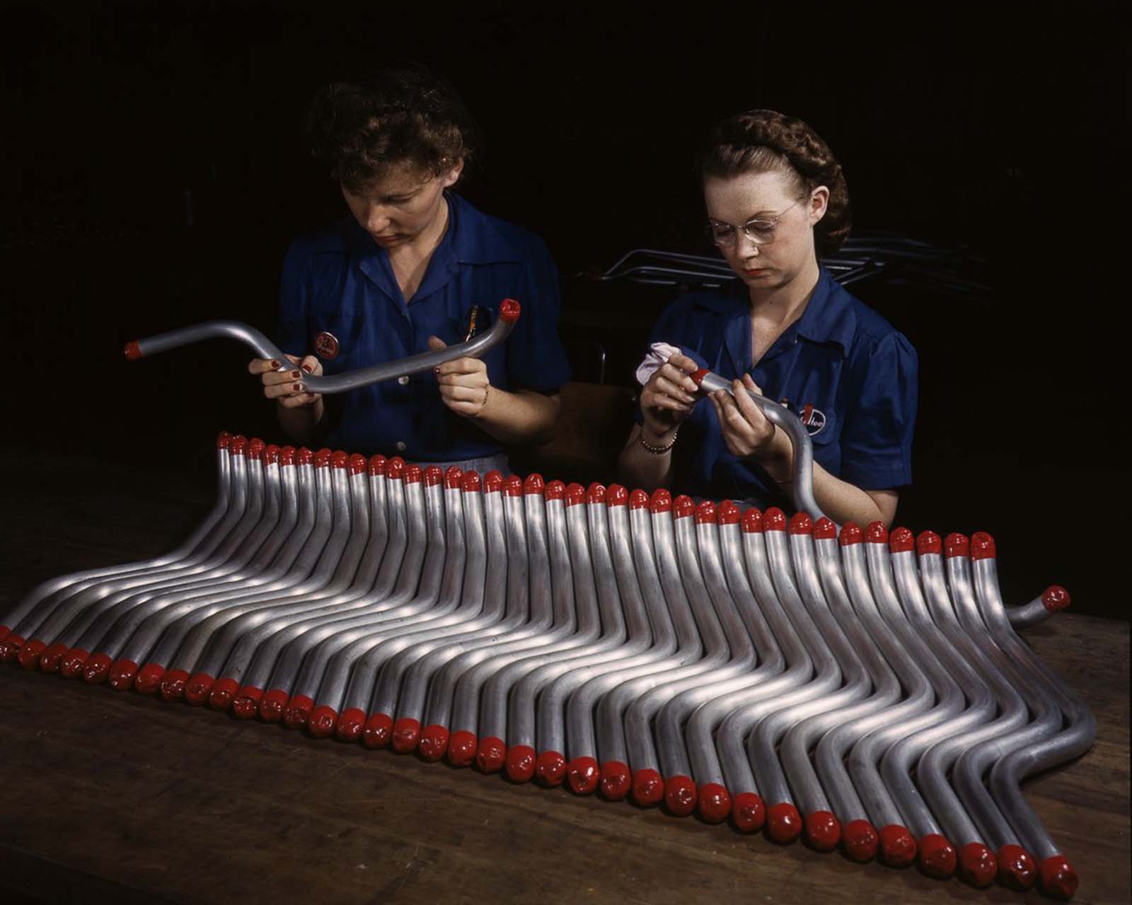 Workers cap and inspect tubing for the A-31 “Vengeance” dive bomber at the Vultee plant in Nashville, Tennessee, 1943.