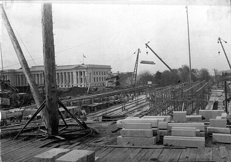Construction begins on Insurance Building with Temple of Justice in background, Washington State Capitol complex, Olympia, April 30, 1920
