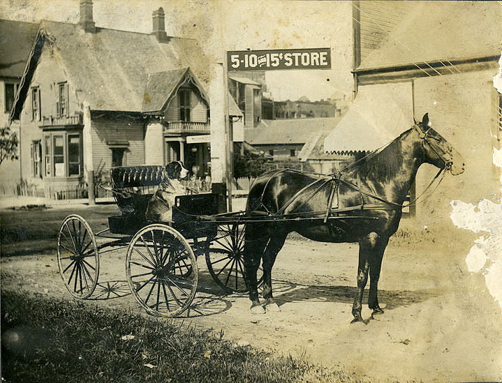 A two-story residence across the way is identified as the John Scott residence, Olympia, 1890s