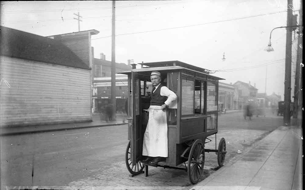 A street food vendor at 4th and Washington, Olympia, 1910s