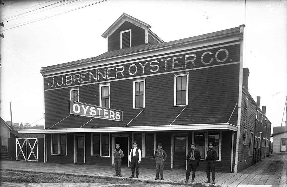 A two-story building known as the J.J. Brenner Oyster Co, 502 4th Ave. W, on the Fourth Avenue Bridge, Olympia, 1914.