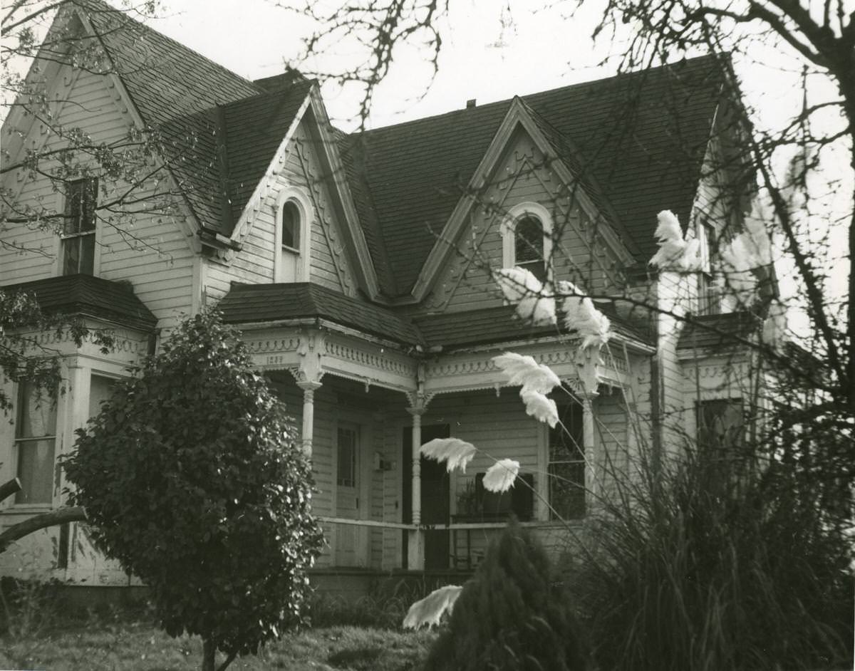 Two-story wooden house with arched windows and porch at 8th Avenue East, Olympia, 1968