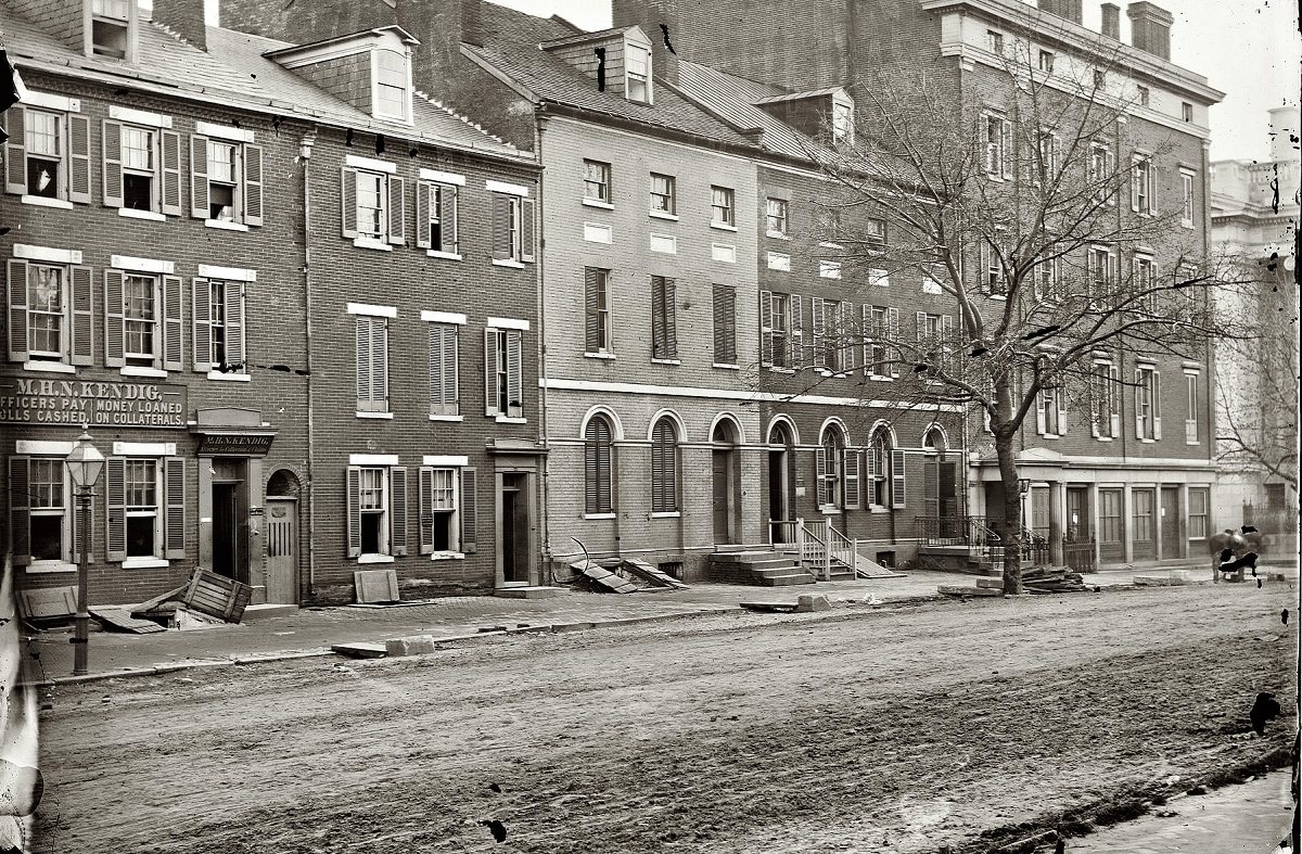 Sanitary Commission storehouse and adjoining houses at 15th and F Streets N.W., Washington, D.C., 1865.