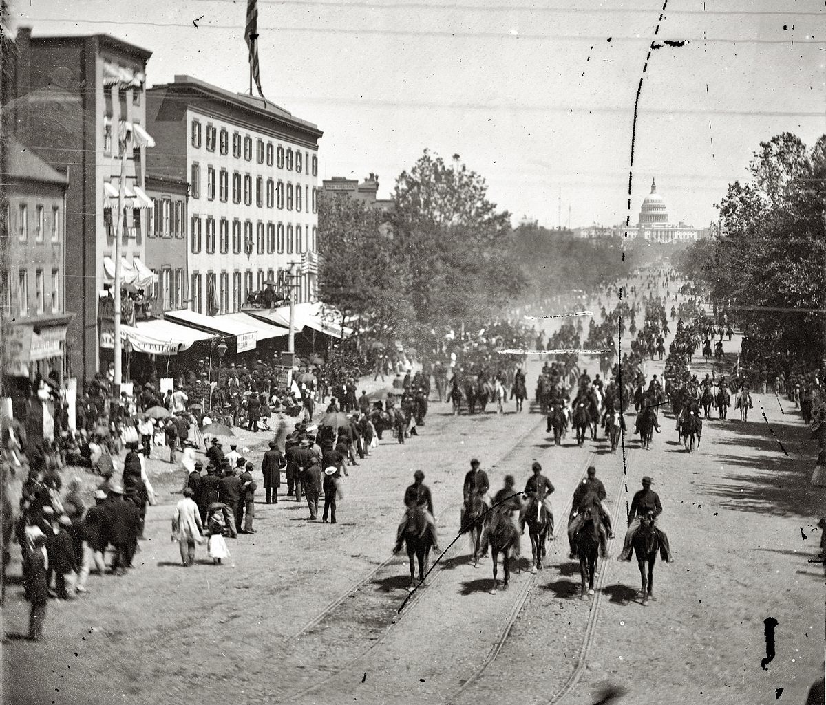 Another artillery unit passing on Pennsylvania Avenue near the Treasury, Washington, D.C., 1865.