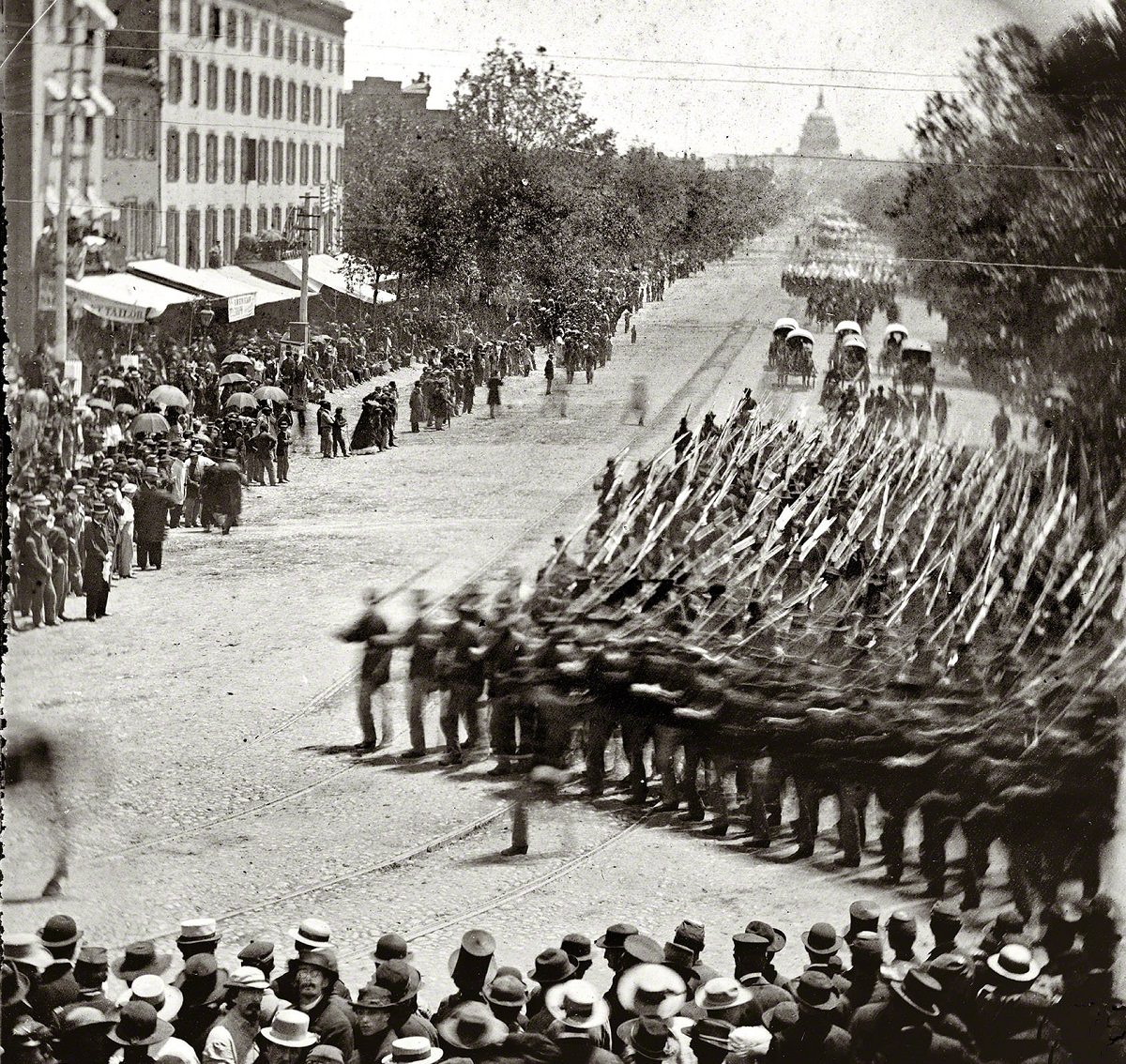 Washington, District of Columbia. The Grand Review of the Army. Units of XX Army Corps, Army of Georgia, passing on Pennsylvania Avenue near the Treasury, Washington, D.C., 1865.