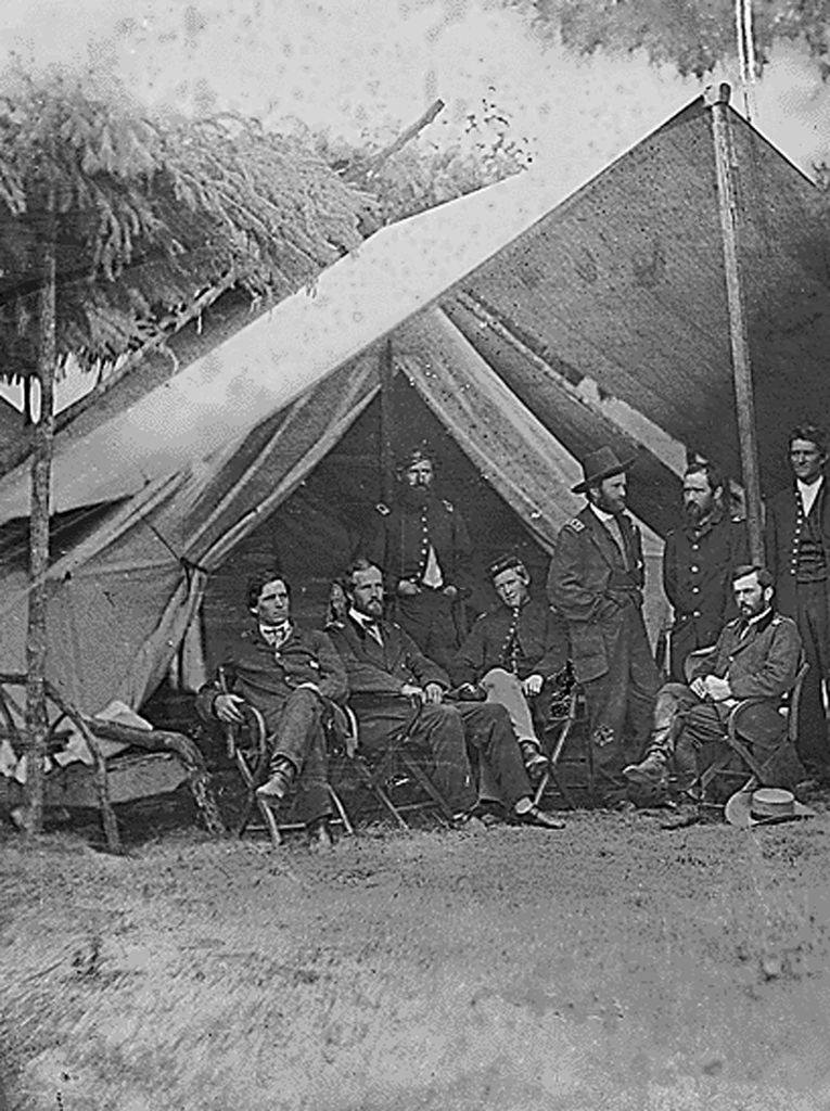 Former US Lt. General Ulysses S. Grant (standing 5th from L) next to a tent with his fellow officers during the US Civil War, 1865.