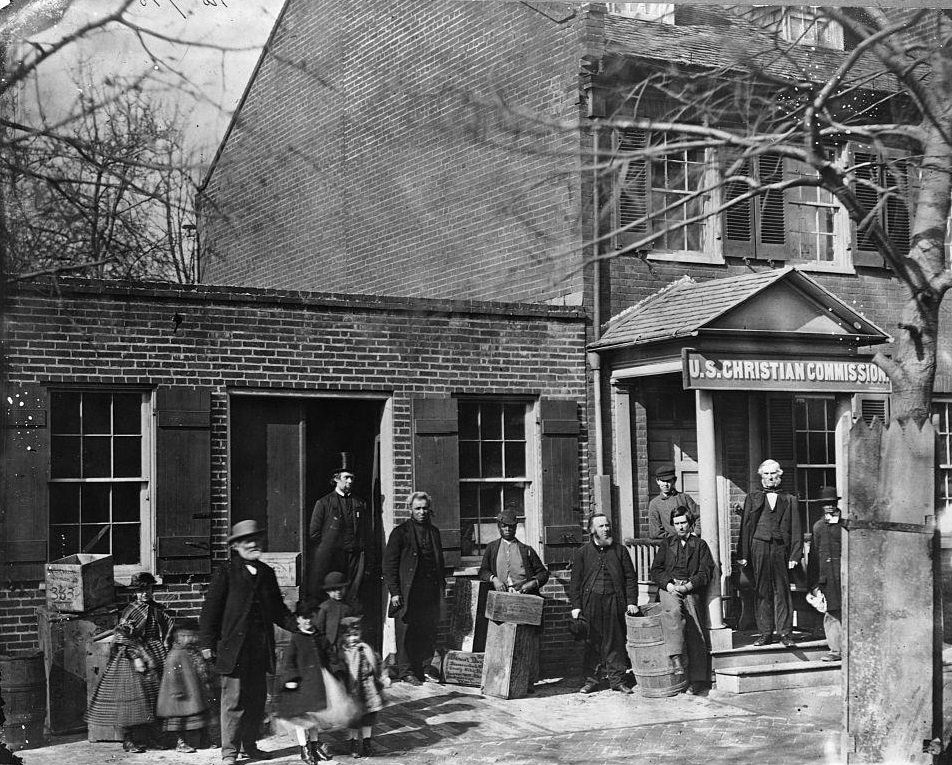 Members of the United States Christian Commission stand outside the organization's Washington D.C. office, 1862.