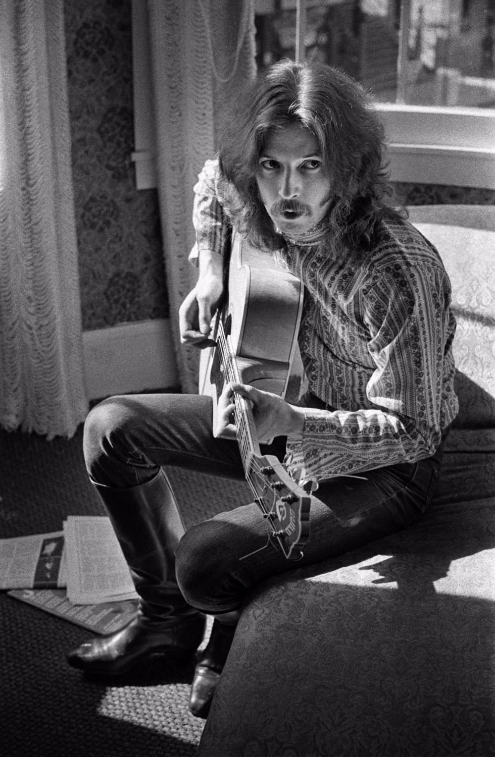 Eric Clapton playing guitar in Jim Marshall’s apartment on Union Street, August 1967.