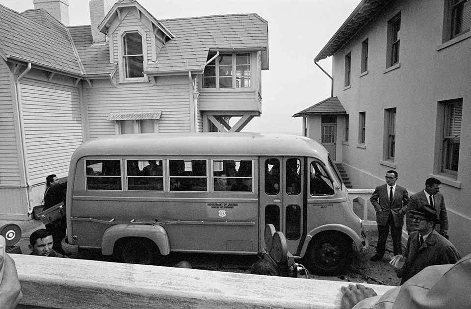 Convict’s Bus - The convicts were driven by bus to the dock. In the background are the Doctor’s House (left) and the Warden’s House.