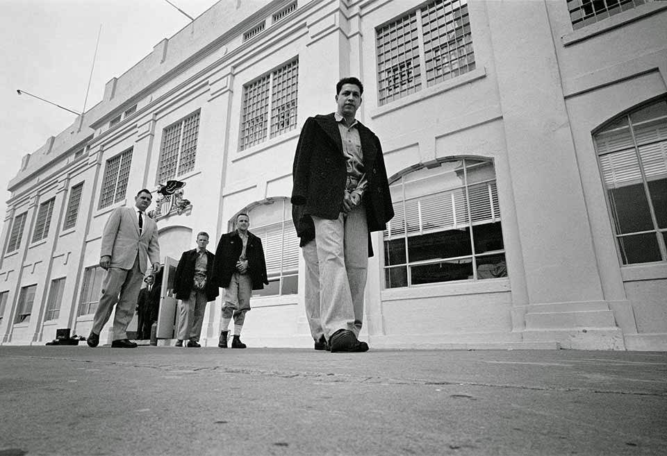 Administration Building - Correctional Officer Jim Albright escorts the last twenty-seven convicts out of the Administration Building.