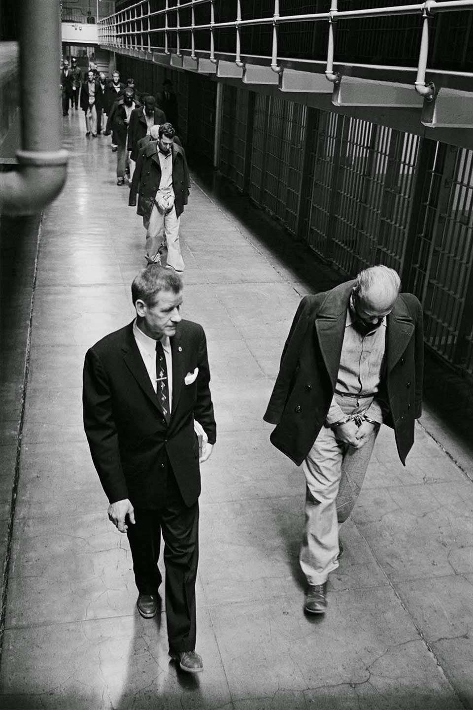 Convicts on Broadway - Handcuffed, shackled and chained, convicts are marched out of United States Penitentiary Alcatraz.