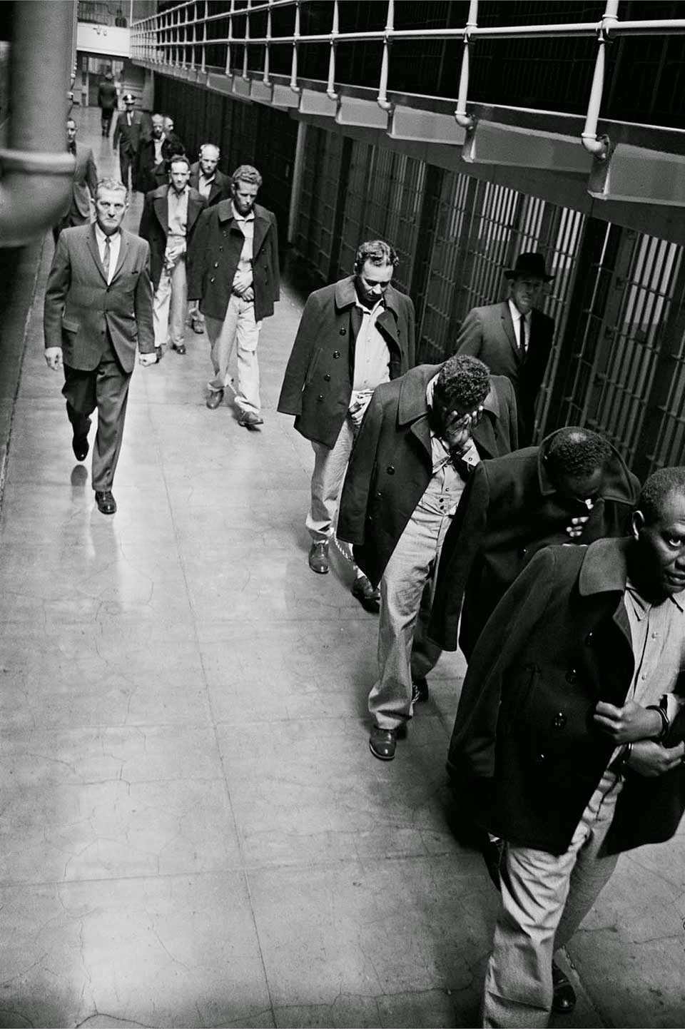 Convicts on Broadway - Handcuffed, shackled and chained, convicts are marched out of United States Penitentiary Alcatraz.