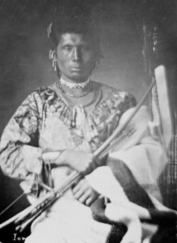 (Front) of Mah-Hee (Knife), Third Chief of Iowas, holding bow and arrows.