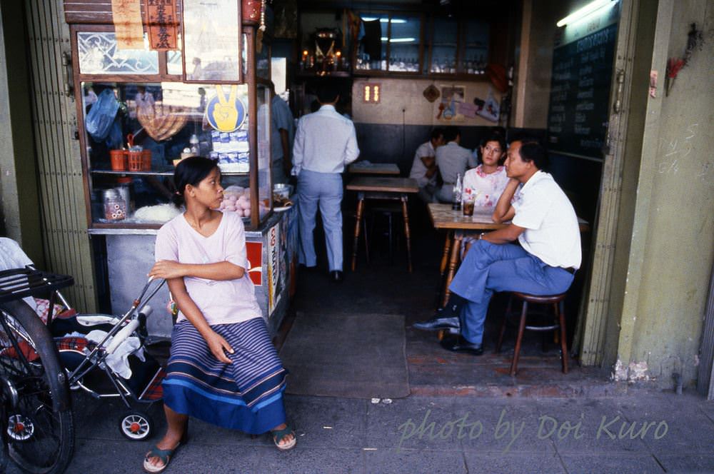 Empty baby carriage outside restaurant