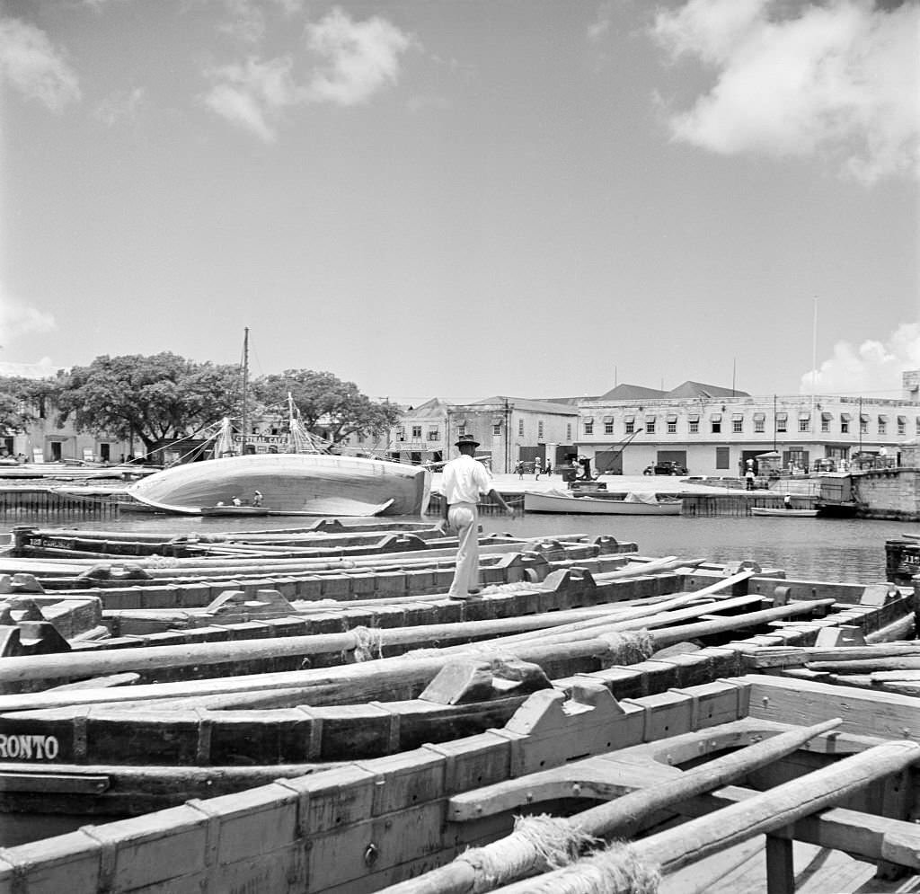 A view of the local harbor and boats in Bridgetown, 1940s