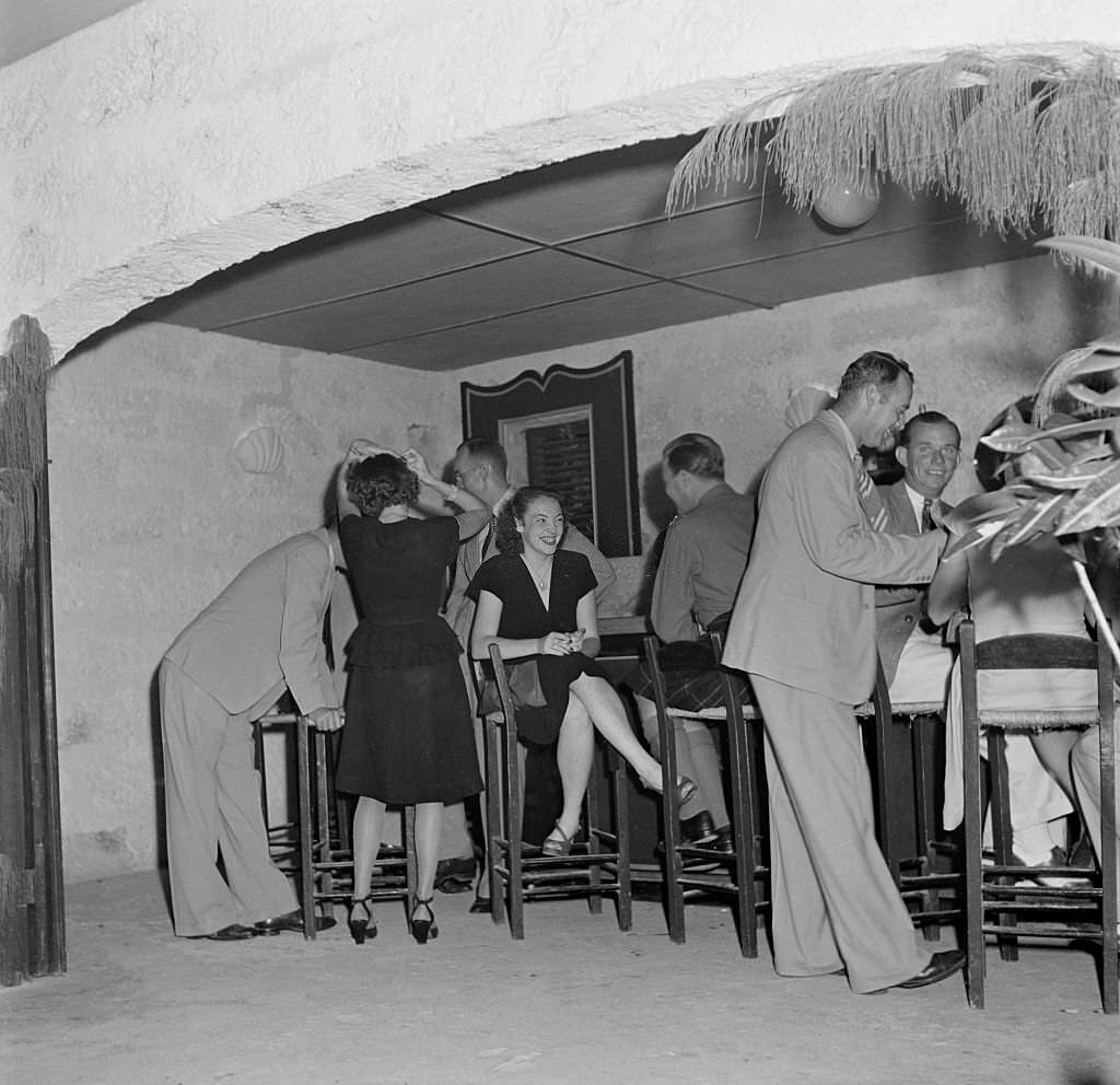 A group gather at a local bar in Bridgetown, 1946