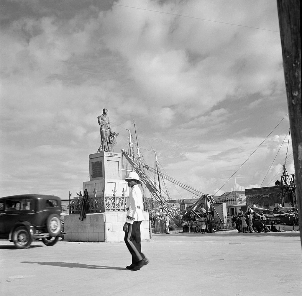 A policemen walks past Lord Nelson Statue in Bridgetown, 1946