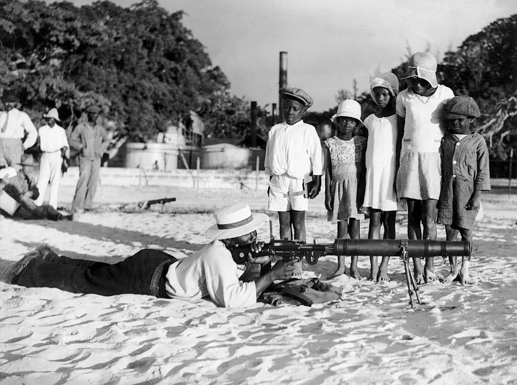 Children watching a Policeman on a Beach of Bridgetown, 1930