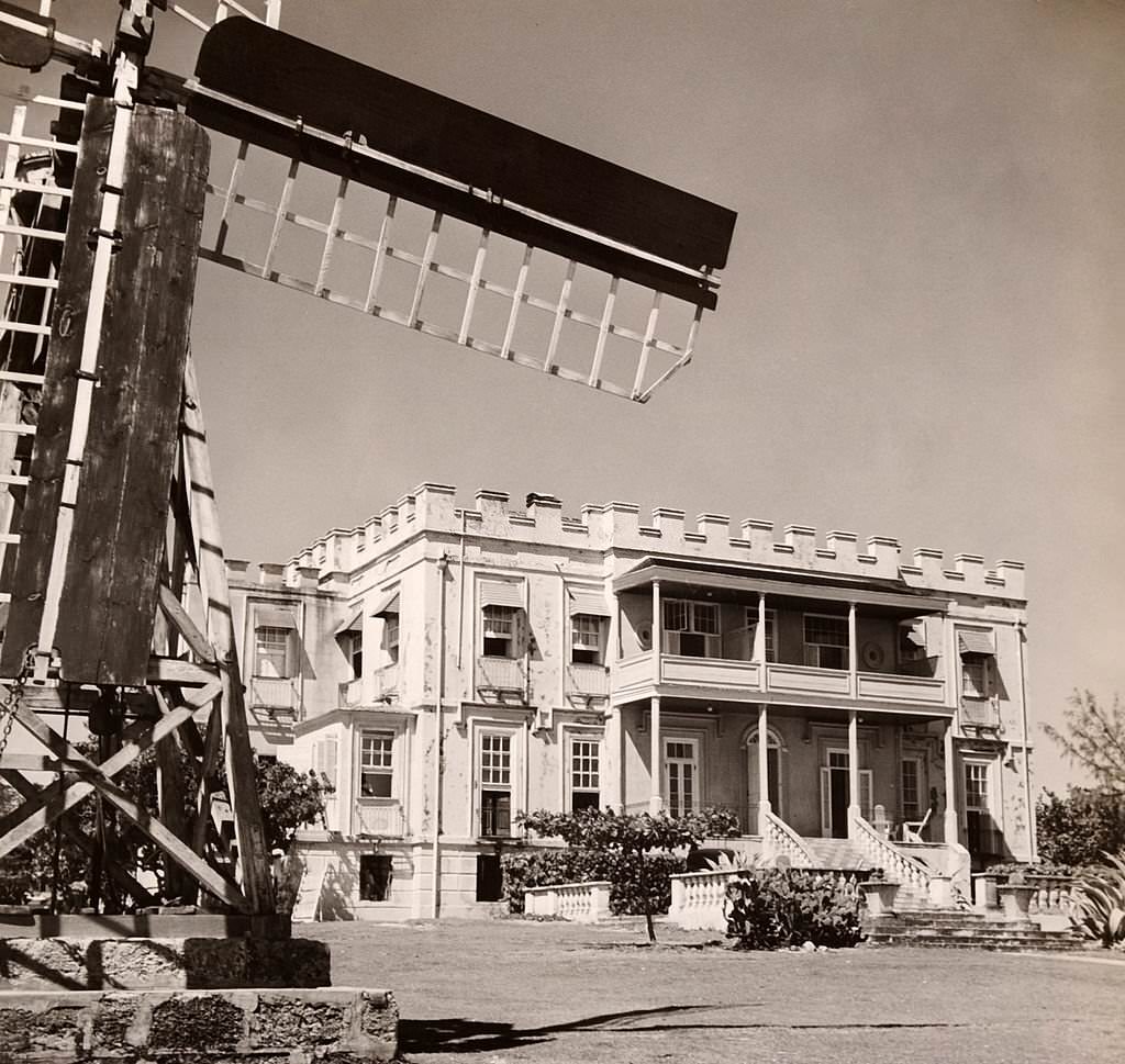 Sam Lord's Castle in the parish of St Philip with a sugar cane plantation windmill in the foreground, 1910