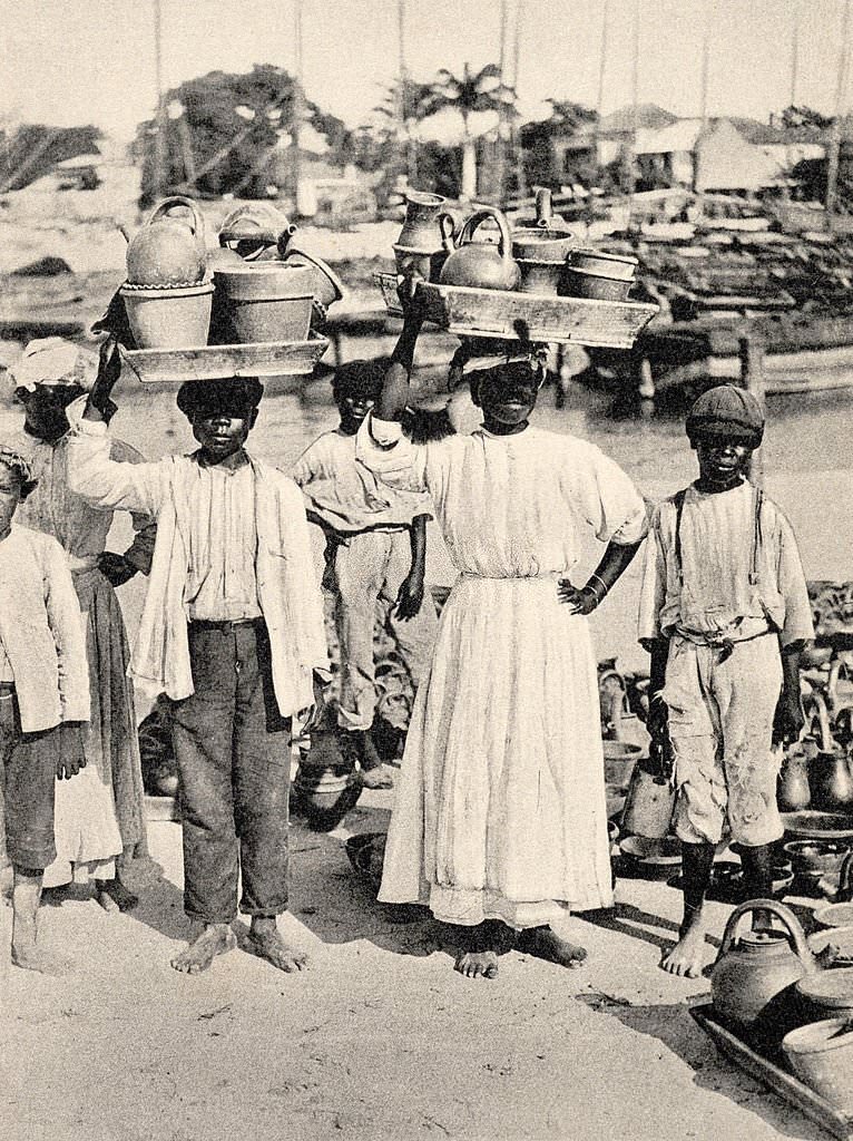 A vintage postcard featuring pottery vendors in Barbados, 1910.