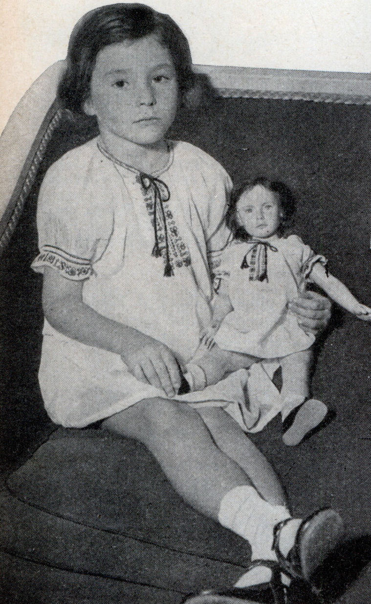 The young subject and her finished doll are.