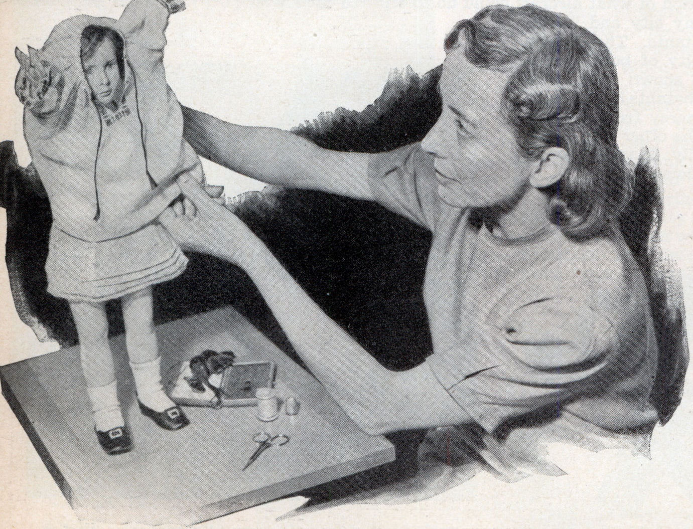Dressing the doll.