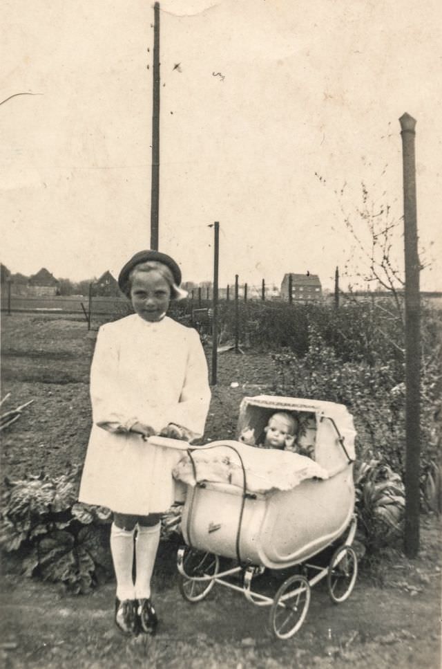 Little girl with a doll in a stroller, 1920s