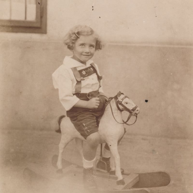 Little girl riding on a rocking horse, 1926