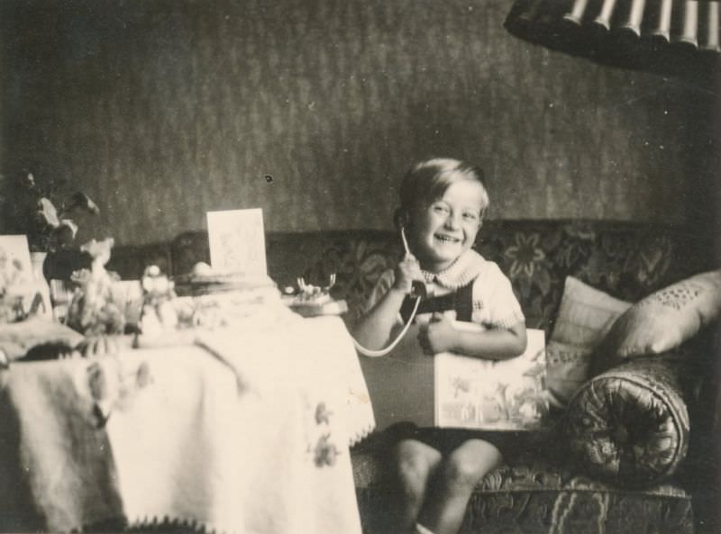 Child playing with a toy telephone