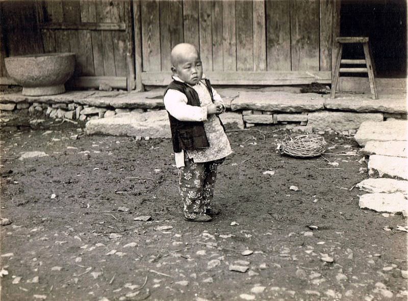Child in front of the yard