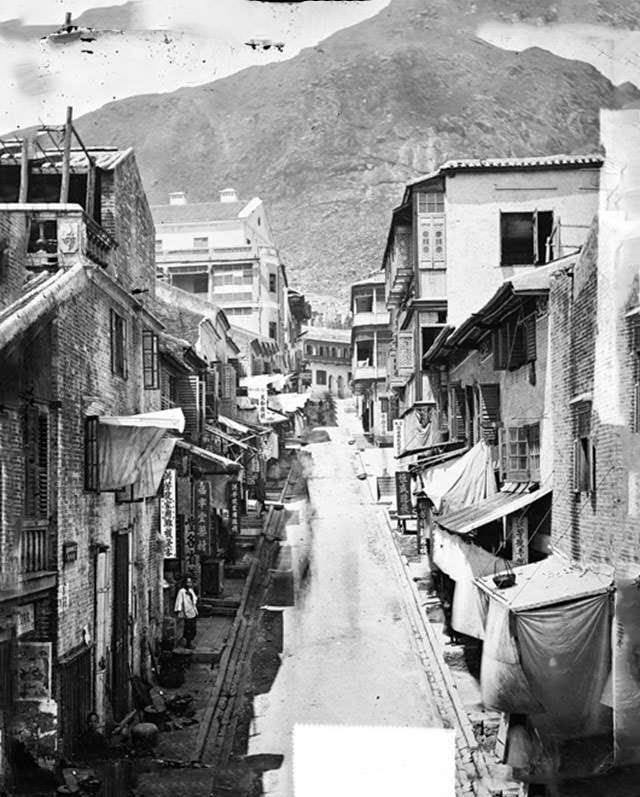 Cochrane Street with Lyndhurst Terrace slices across the background, Wellington Street crosses the middle and a pawn shop on the Northeast corner, 1870