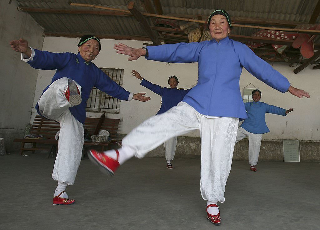 Members of the Bound Feet Women Dancing Team, practise dancing at Liuyi Village on April 2, 2007