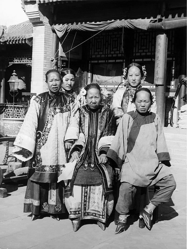 Group portrait of wealthy Chinese women with bound feet.