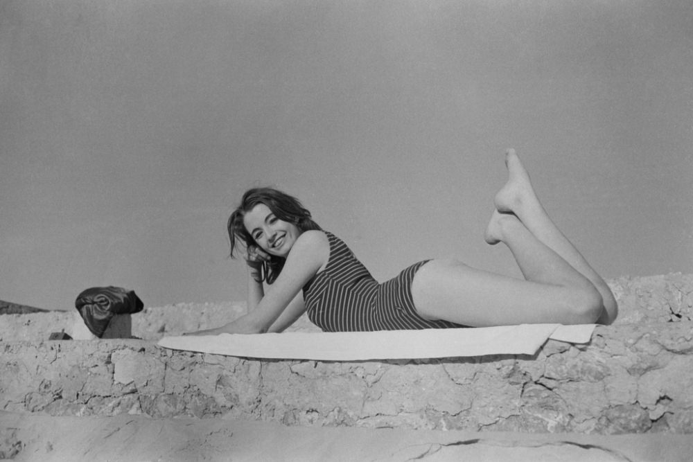 Christine Keeler Posing in a Swimsuit on a Beach in Spain and France, 1963