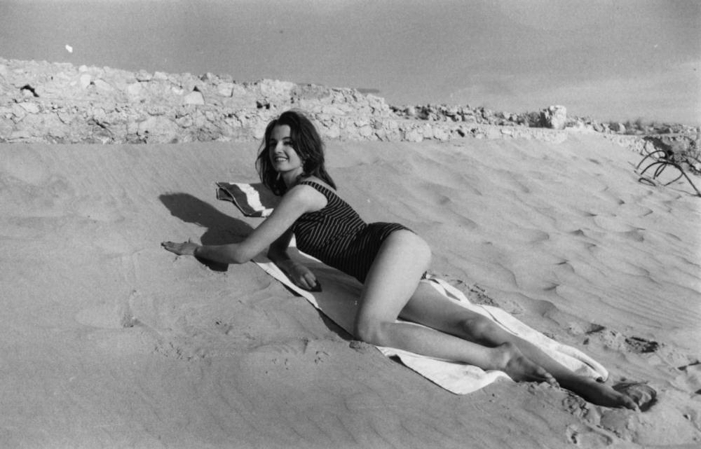 Christine Keeler Posing in a Swimsuit on a Beach in Spain and France, 1963