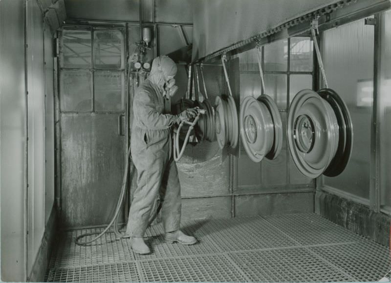 Spraypainting wheel hubs, 1951
