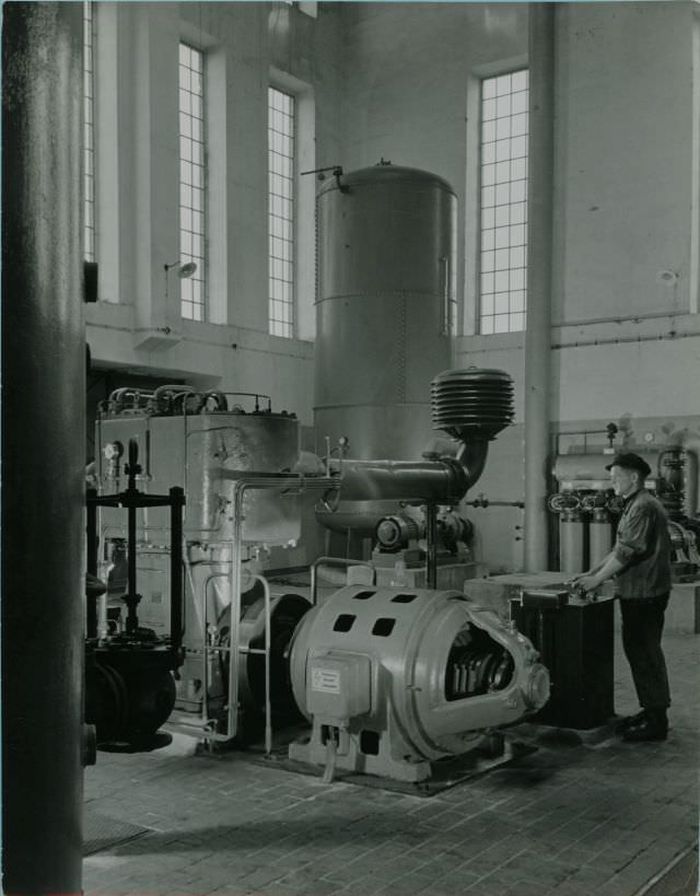 Worker adjusting motor speed, 1951