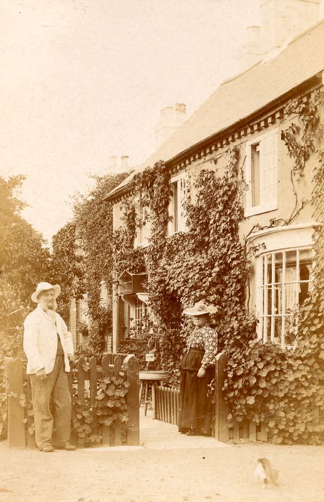 Older couple outside large house